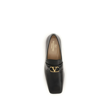 Loafer Slip-On Shoes by Valentino Garavani for men in bos taurus calf & goatskin leather black & signature showcases a timeless silhouette from the V Logo Men's Bos Taurus Calf & Goatskin Leather Loafer Slip-On Shoes collection, featuring a timeless and for a timeless finish.