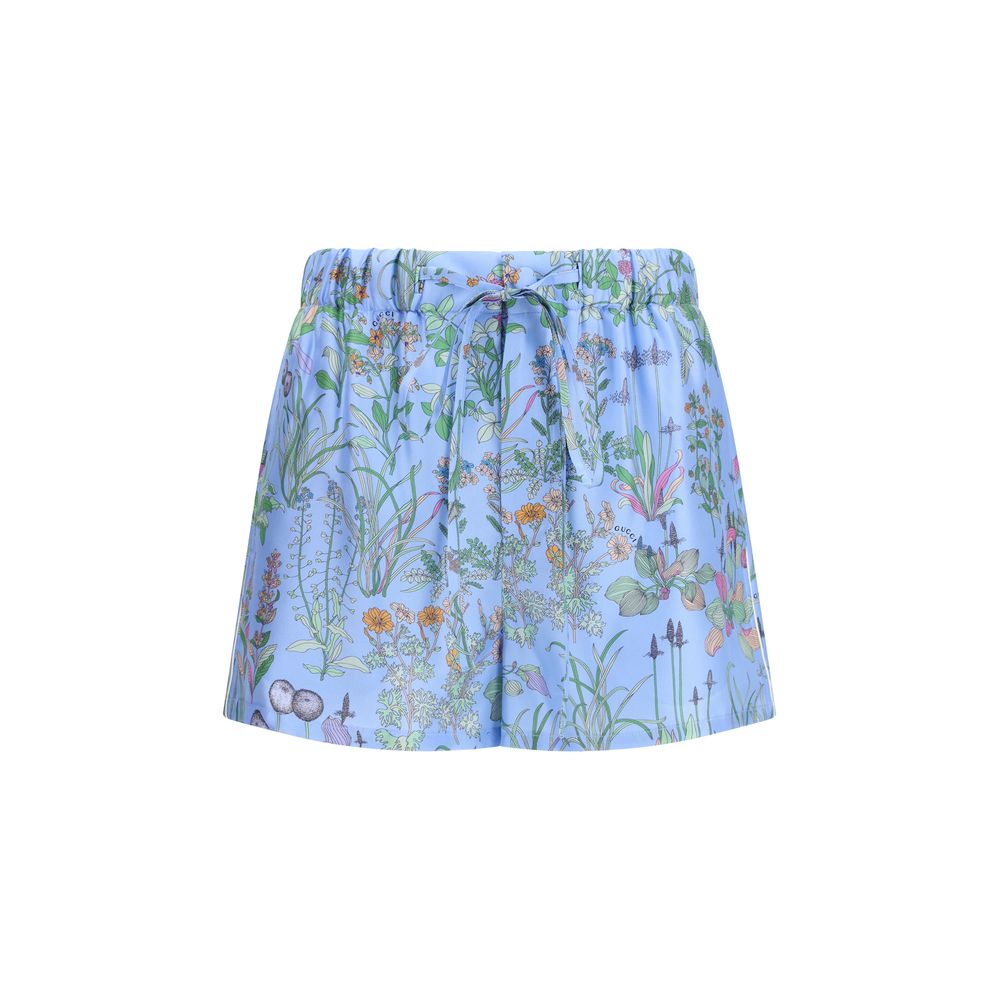 Short Trousers by Gucci for women in silk twill blue, floral & print features an sartorial design, highlighting a sophisticated regular-fit with a short cut and a refined for a truly sartorial look.