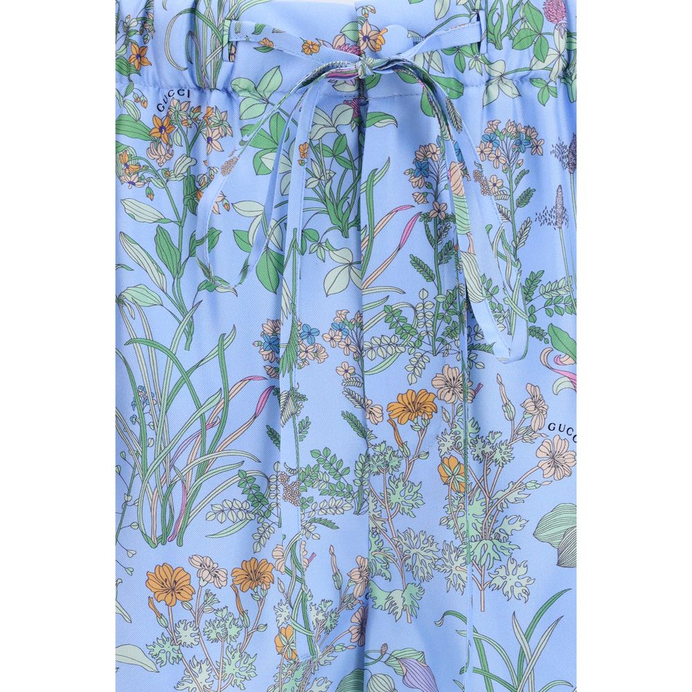 Short Trousers by Gucci for women in silk twill blue, floral & print showcases a effortlessly chic silhouette, artfully tailored with a effortlessly chic regular-fit, a short cut, and a refined for a effortlessly chic finish.
