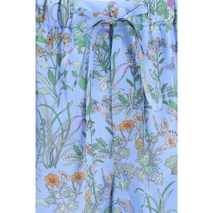 Short Trousers by Gucci for women in silk twill blue, floral & print showcases a effortlessly chic silhouette, artfully tailored with a effortlessly chic regular-fit, a short cut, and a refined for a effortlessly chic finish.