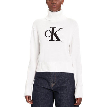 Sweater by Calvin Klein Jeans for women in cotton white showcases a downtown chic silhouette, artfully finished with a downtown chic turtle neckline and for a sophisticated, high-end look.