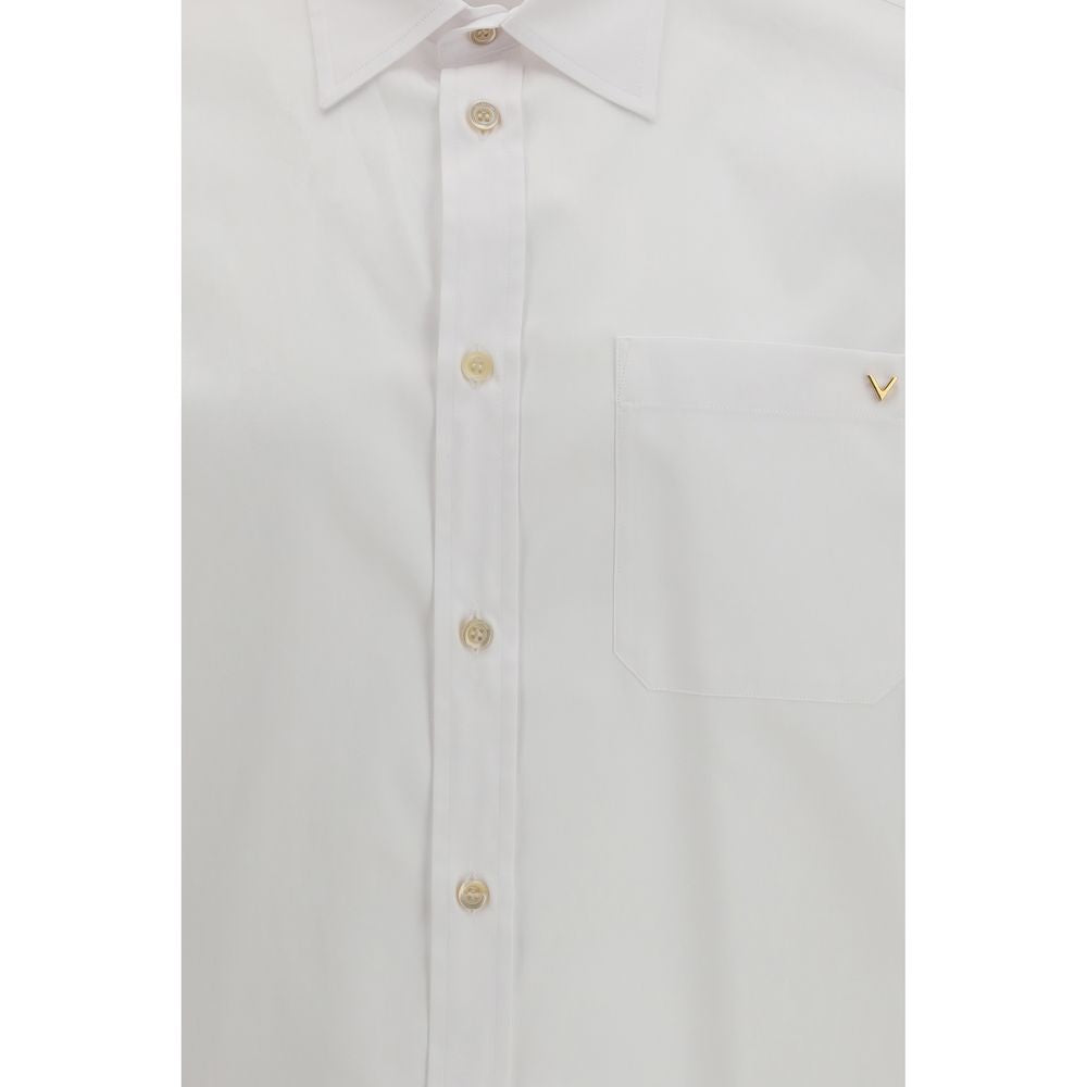 Dress Shirt by Valentino Garavani for men in cotton white showcases a sharp silhouette, elegantly detailed with a sharp and sharp .