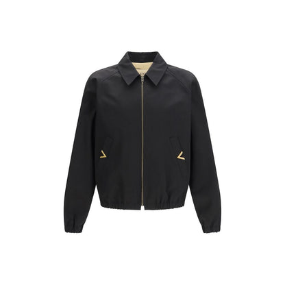 Bomber Jacket by Valentino Garavani for men in cotton black features a city-ready silhouette, detailed with pockets and a city-ready .