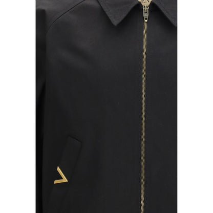 Bomber Jacket by Valentino Garavani for men in cotton black features a dramatic silhouette, showcasing a sophisticated and distinctive pockets for a dramatic aesthetic.