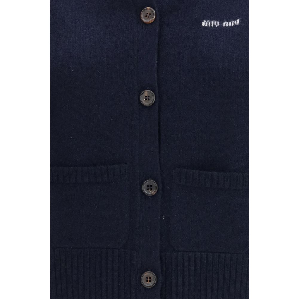 Cardigan by Miu Miu for women in cashmere blue & signature showcases a captivating silhouette, artfully detailed with a captivating and v-neck neckline for a truly sophisticated captivating look.