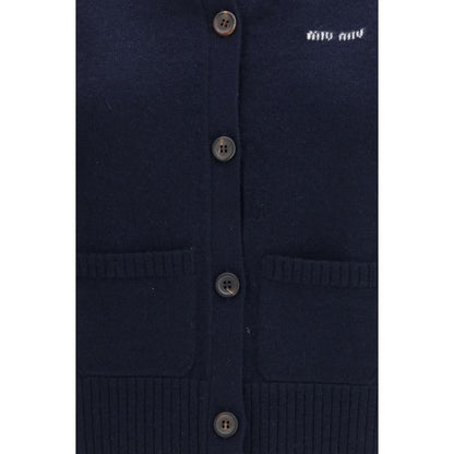 Cardigan by Miu Miu for women in cashmere blue & signature showcases a captivating silhouette, artfully detailed with a captivating and v-neck neckline for a truly sophisticated captivating look.