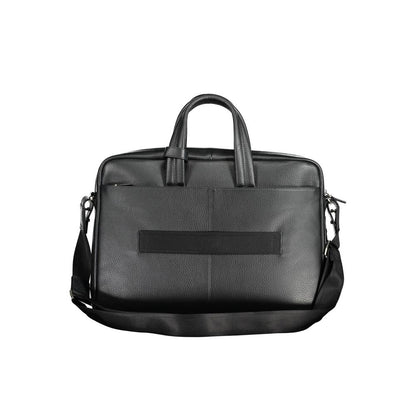 This Briefcase Handbag by Piquadro for unisex in leather and black presents a sculptural silhouette featuring a secure zipper, ample external-pockets & laptop-compartment, and versatile shoulder-strap, adjustable-strap, detachable-strap & handle for a sculptural finish.