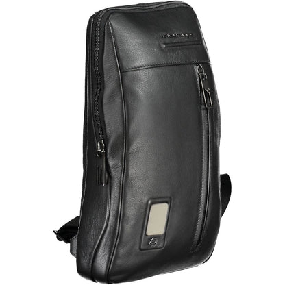 Shoulder Bag by Piquadro for men in leather black features a stately silhouette, showcasing a secure zipper, ample external-pockets, internal-pockets & laptop-compartment, and stately shoulder-strap for a stately finish.