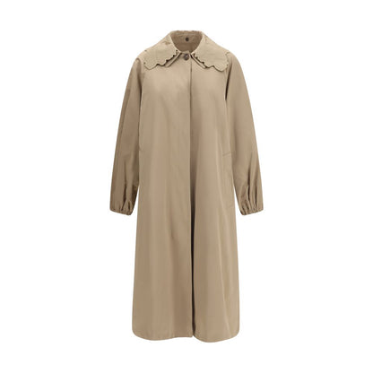 Trench Coat by Fabiana Filippi for women in cotton polyester beige features an dramatic silhouette, perfectly showcasing the elegant and sophisticated insulated for a truly dramatic aesthetic.