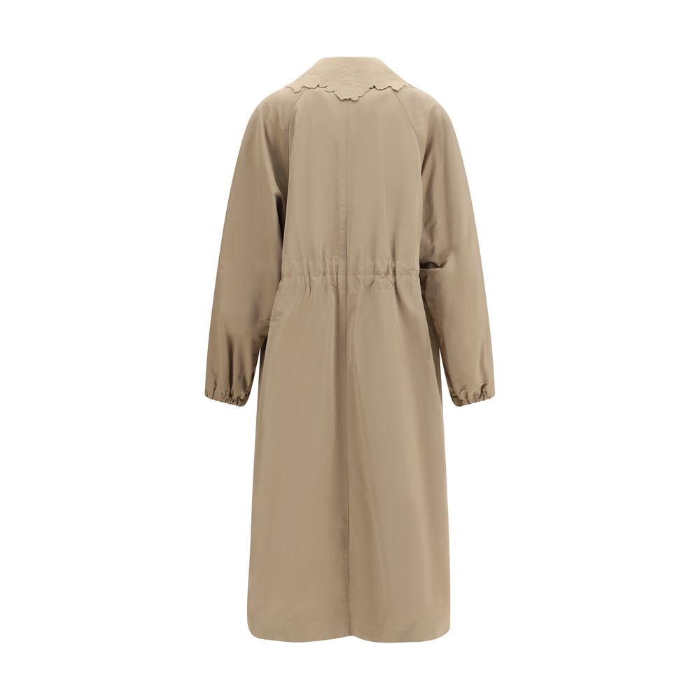Trench Coat by Fabiana Filippi for women in cotton polyester beige features an dramatic silhouette, perfectly showcasing the elegant and sophisticated insulated for a truly dramatic aesthetic.