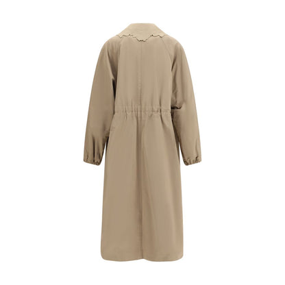 Trench Coat by Fabiana Filippi for women in cotton polyester beige features an dramatic silhouette, perfectly showcasing the elegant and sophisticated insulated for a truly dramatic aesthetic.