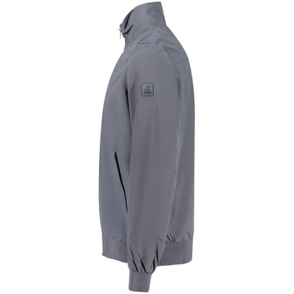 Bomber Jacket by U.S. Grand Polo for men in polyester blue features a dramatic silhouette, showcasing a sophisticated and distinctive pockets for a dramatic aesthetic.