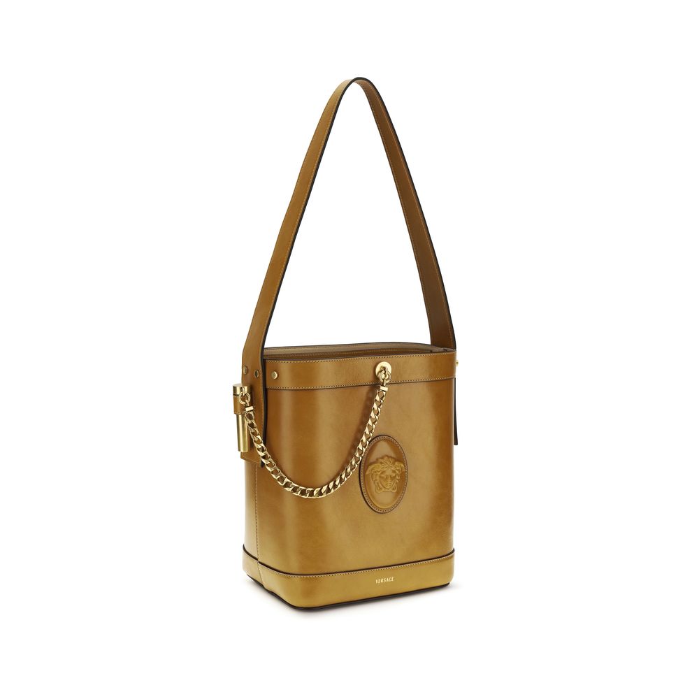Small Shoulder Bucket Bag by Versace for women in bos taurus calf leather brown features a effortless sophistication silhouette, secured by a flap with ample and versatile shoulder-strap & handle for a effortless sophistication finish.