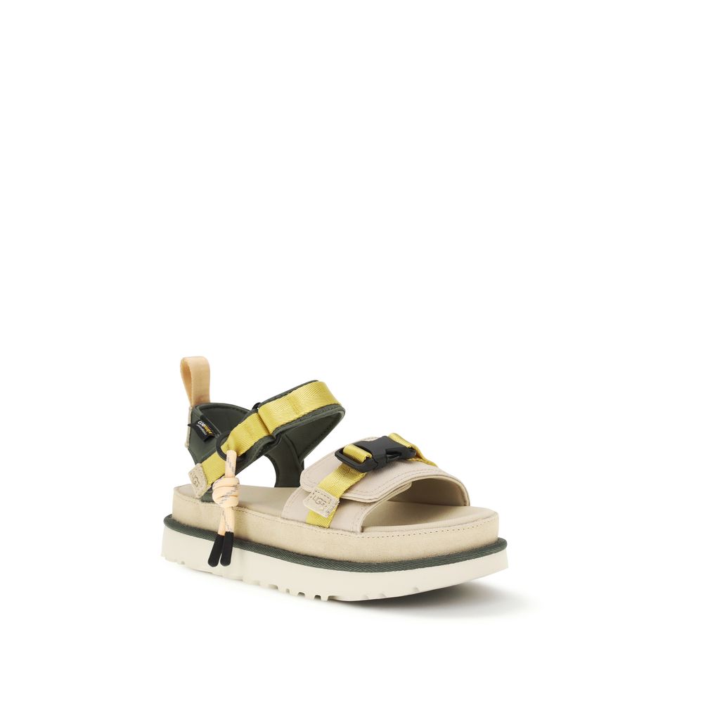 Flat Ankle Strap Sandals by UGG for women in cordura & polyester beige & natural showcases a sculptural silhouette as Cordura Women's & Polyester Flat Ankle Strap Sandals, defined by a sculptural flat and sculptural for a sculptural look.