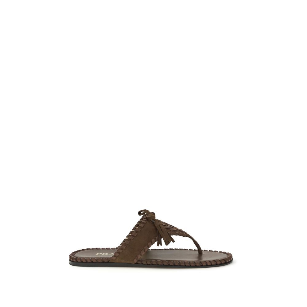 Flat Thong Sandals by Prada for women in bos taurus calf suede leather brown, gold & monogram features an architectural design from the Women's Bos Taurus Calf Suede Leather Flat Thong Sandals collection, defined by a architectural flat and for a architectural finish.