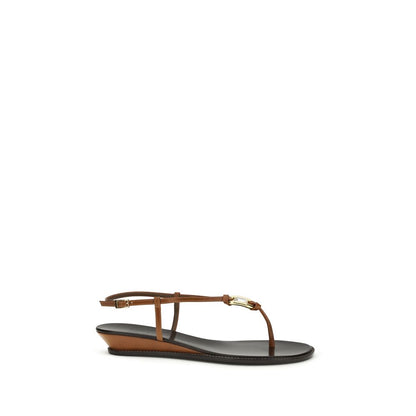 Wedge Thong Sandals by Giuseppe Zanotti for women in bos taurus calf leather & crystal brown & gold showcases a sculptural silhouette as Women's Bos Taurus Calf Leather & Crystal Wedge Thong Sandals, defined by a sculptural wedge and sculptural for a sculptural look.