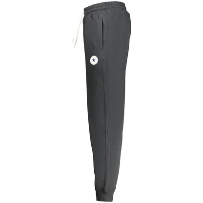 Joggers by Converse for men in cotton black features a polished silhouette with a polished regular-fit, reaching a polished long and finished with a polished .