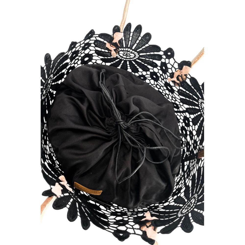 Drawstring Pouch Shoulder Bag by Baldinini Trend for women in polyurethane black, patterned & floral features a statuesque silhouette, showcasing a secure drawstring and statuesque with versatile detachable-strap & handle for a statuesque finish.
