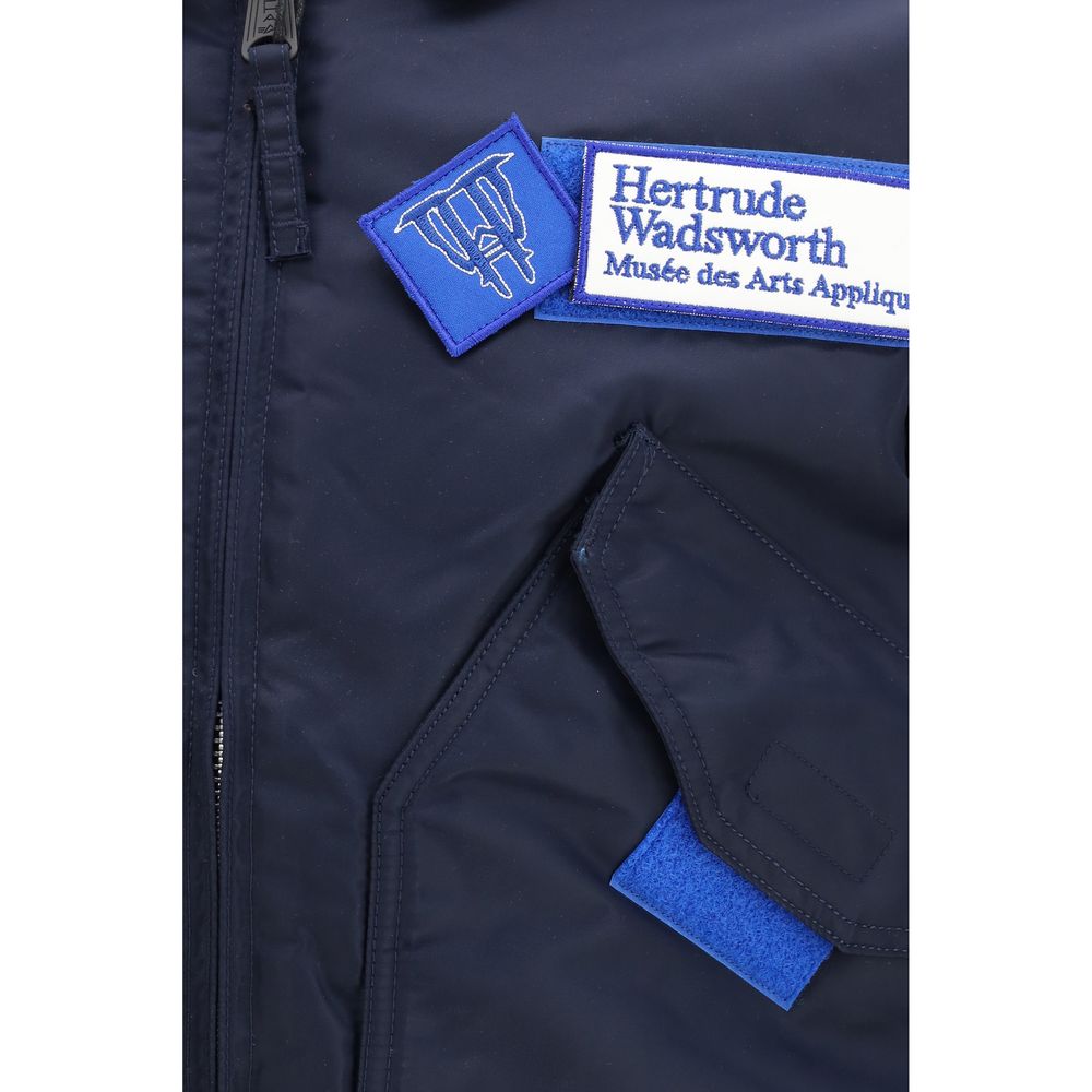 Bomber Jacket by GR10K for men in nylon blue showcases a bohemian silhouette, artfully detailed with a bohemian and signature pockets for a truly bohemian finish.