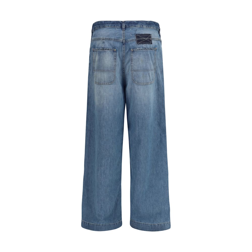 Jeans by Maison Margiela for women in denim cotton blue & patchwork features an sophisticated and relaxed-fit, wide & oversized with a precise long, creating a sophisticated and sophisticated silhouette.