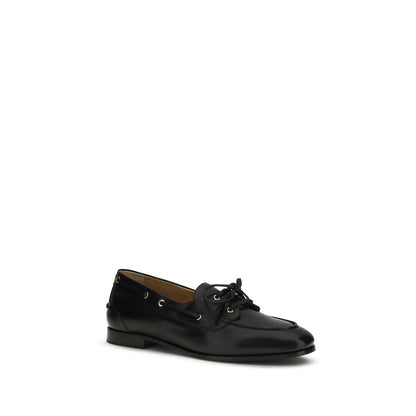 Boat Loafer Slip-On Shoes by Bally for men in buffalo leather black & gold showcases a impeccable silhouette as Men's Buffalo Leather Boat Loafer Slip-On Shoes, artfully designed with a impeccable and refined for a impeccable finish.