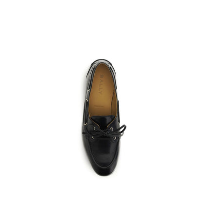 Boat Loafer Slip-On Shoes by Bally for men in buffalo leather black & gold showcases a timeless silhouette from the Men's Buffalo Leather Boat Loafer Slip-On Shoes collection, featuring a timeless and for a timeless finish.