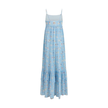 Dress by Fiorucci for women in viscose blue & print features a dramatic silhouette, showcasing an elegant and that flows into a dramatic maxi long.
