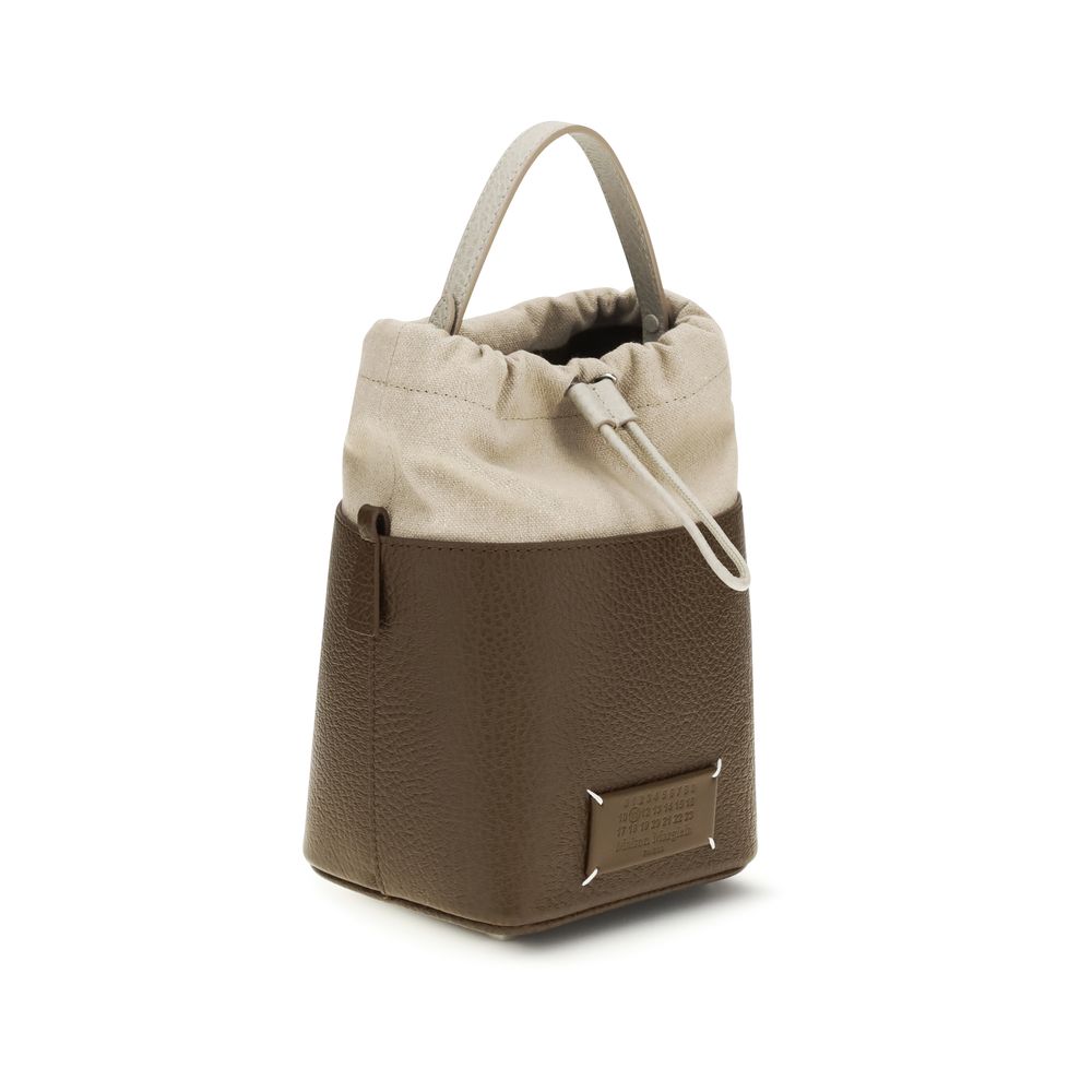 Bucket Handbag by Maison Margiela for women in bos taurus calf leather brown & signature features a effortlessly chic silhouette, showcasing a secure with ample and versatile for a effortlessly chic finish.