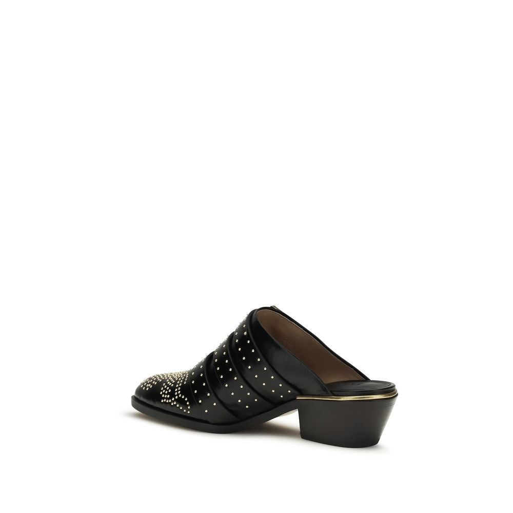 Mules Flat Shoes by Chloé for women in bos taurus calf leather black presents a impeccable silhouette as Icon Women's Bos Taurus Calf Leather Mules Flat Shoes, artfully designed with a and a impeccable for a refined, upscale finish.