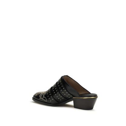 Mules Flat Shoes by Chloé for women in bos taurus calf leather black presents a impeccable silhouette as Icon Women's Bos Taurus Calf Leather Mules Flat Shoes, artfully designed with a and a impeccable for a refined, upscale finish.