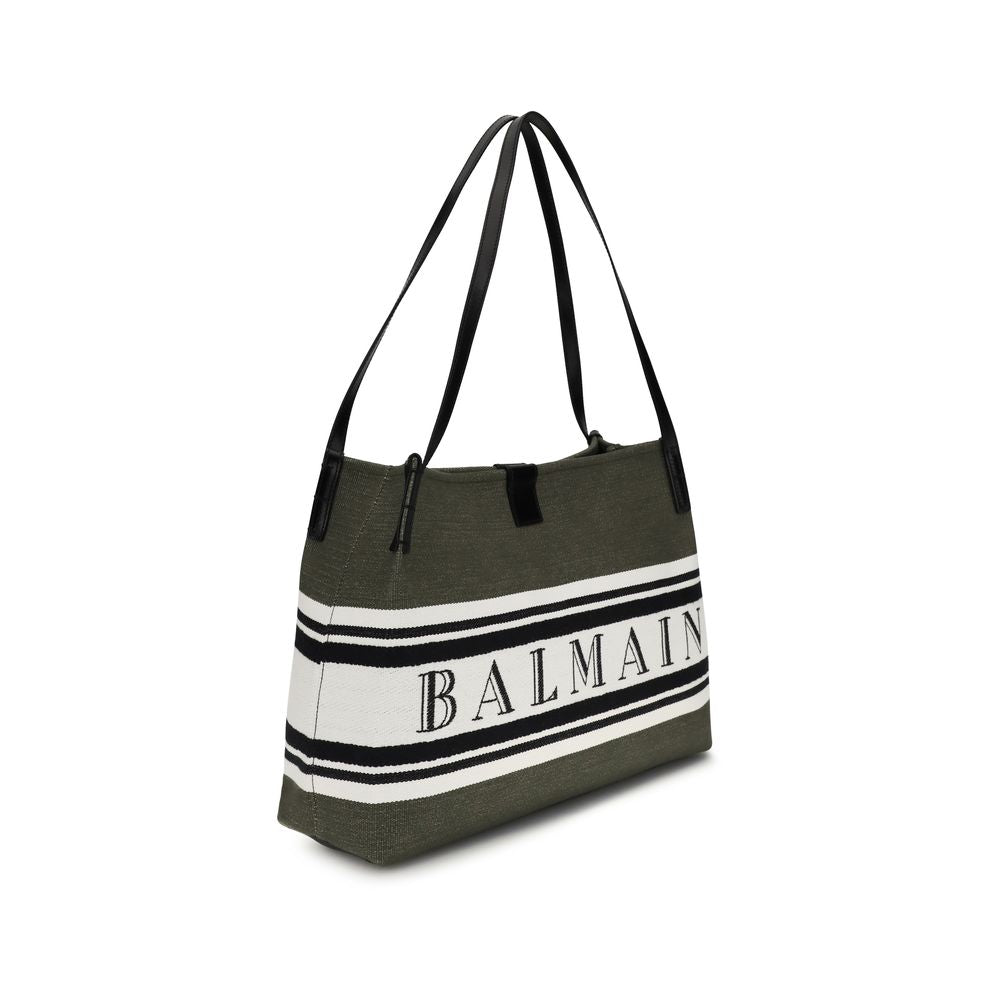 Medium Tote Handbag by Balmain for women in polyester cotton & suede calfskin leather black features an refined silhouette, showcasing a secure snap & button, ample , and versatile adjustable-strap for a sophisticated refined aesthetic.