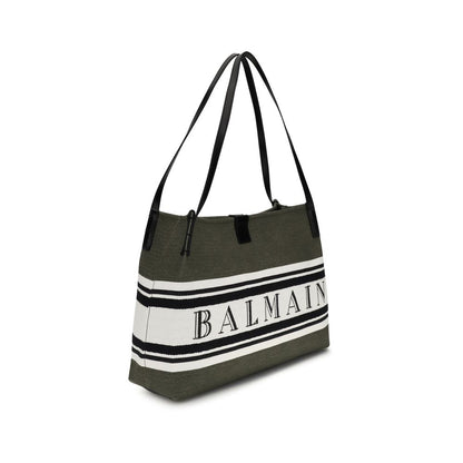 Medium Tote Handbag by Balmain for women in polyester cotton & suede calfskin leather black features an refined silhouette, showcasing a secure snap & button, ample , and versatile adjustable-strap for a sophisticated refined aesthetic.