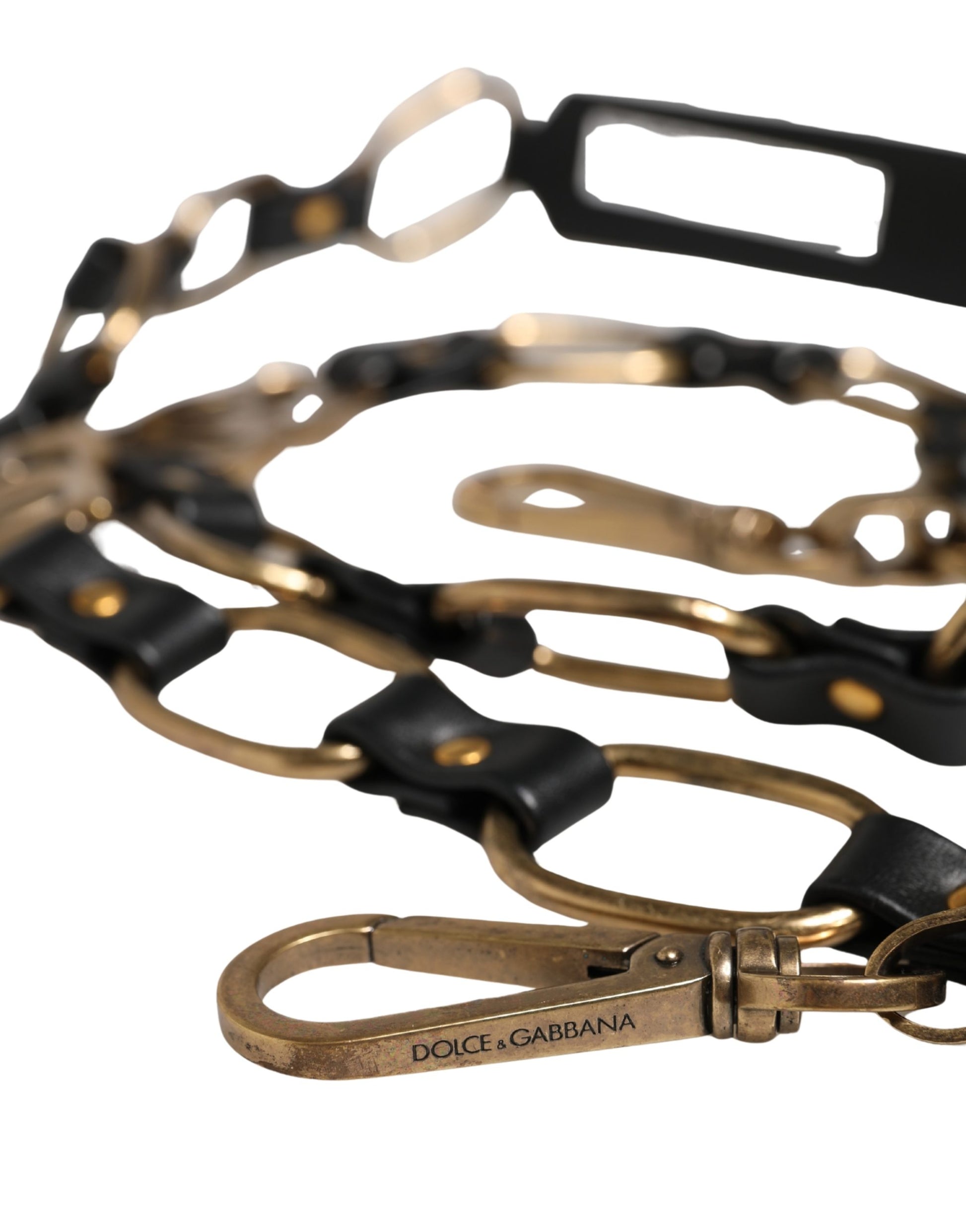 Shoulder Strap by Dolce & Gabbana for women in brass zamak & calf leather black & gold features a dynamic silhouette, artfully enhancing the dynamic design of this Brass Zamak Calf Leather Shoulder Strap.