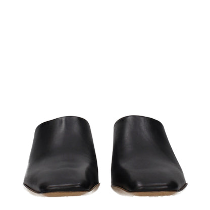 Clogs Slippers by Jil Sander for women in leather black features an effortless chic silhouette from the Women's Leather Clogs Slippers collection, showcasing a and effortless chic .