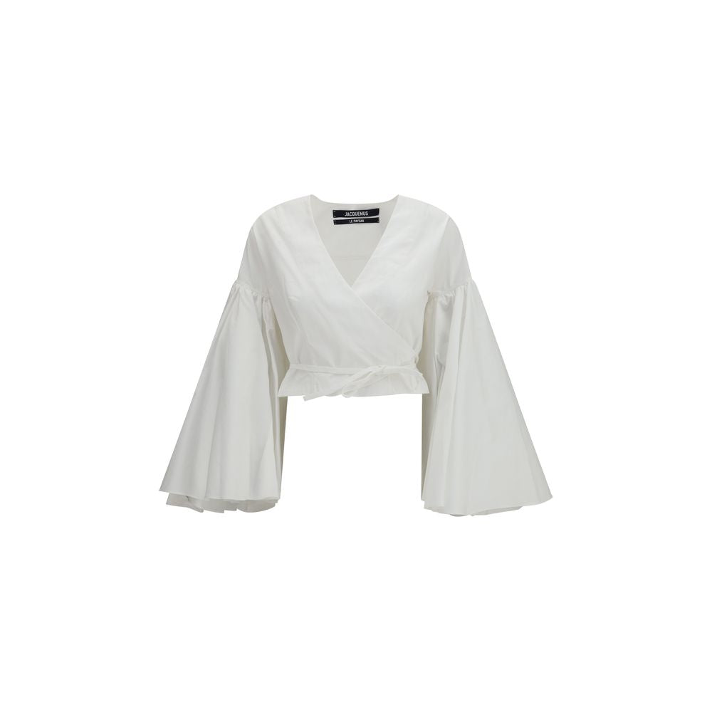 Shirt by Jacquemus for women in cotton white showcases a sublime silhouette, artfully detailed with a sublime wrap v-neck neckline and long-sleeve for a sophisticated, sublime finish.