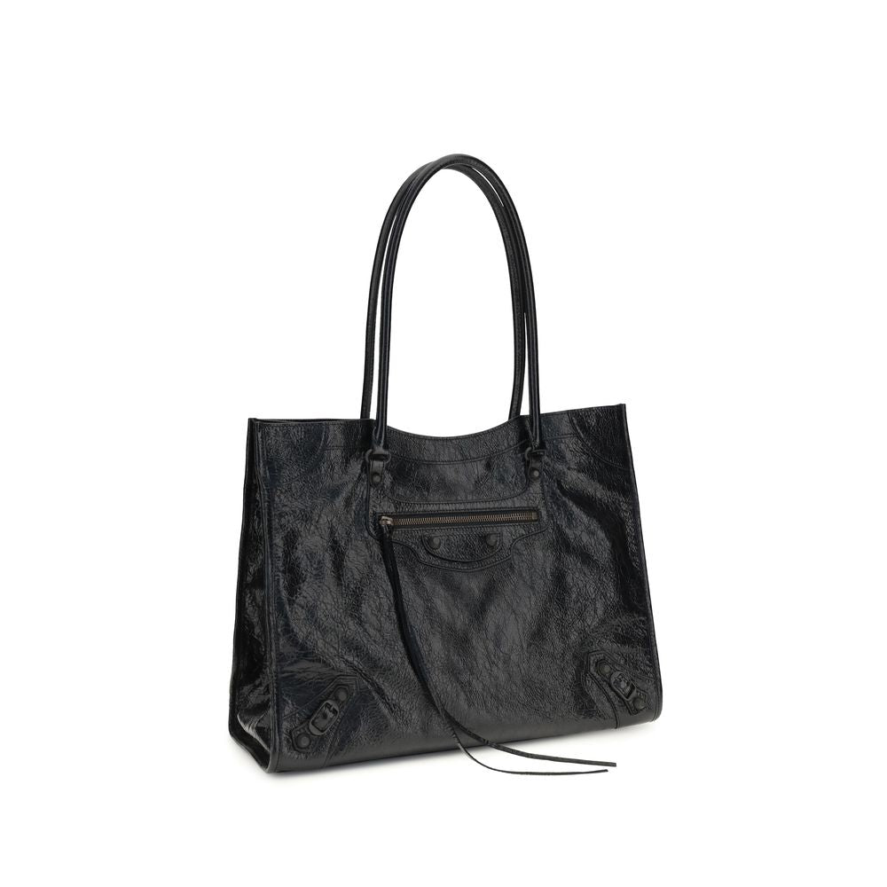 Small Crossbody Tote Shoulder Bag by Balenciaga for women in black features a enviable silhouette, showcasing a secure zipper & magnetic, ample internal-pockets, and enviable crossbody-strap, handle & adjustable-strap for a enviable finish.