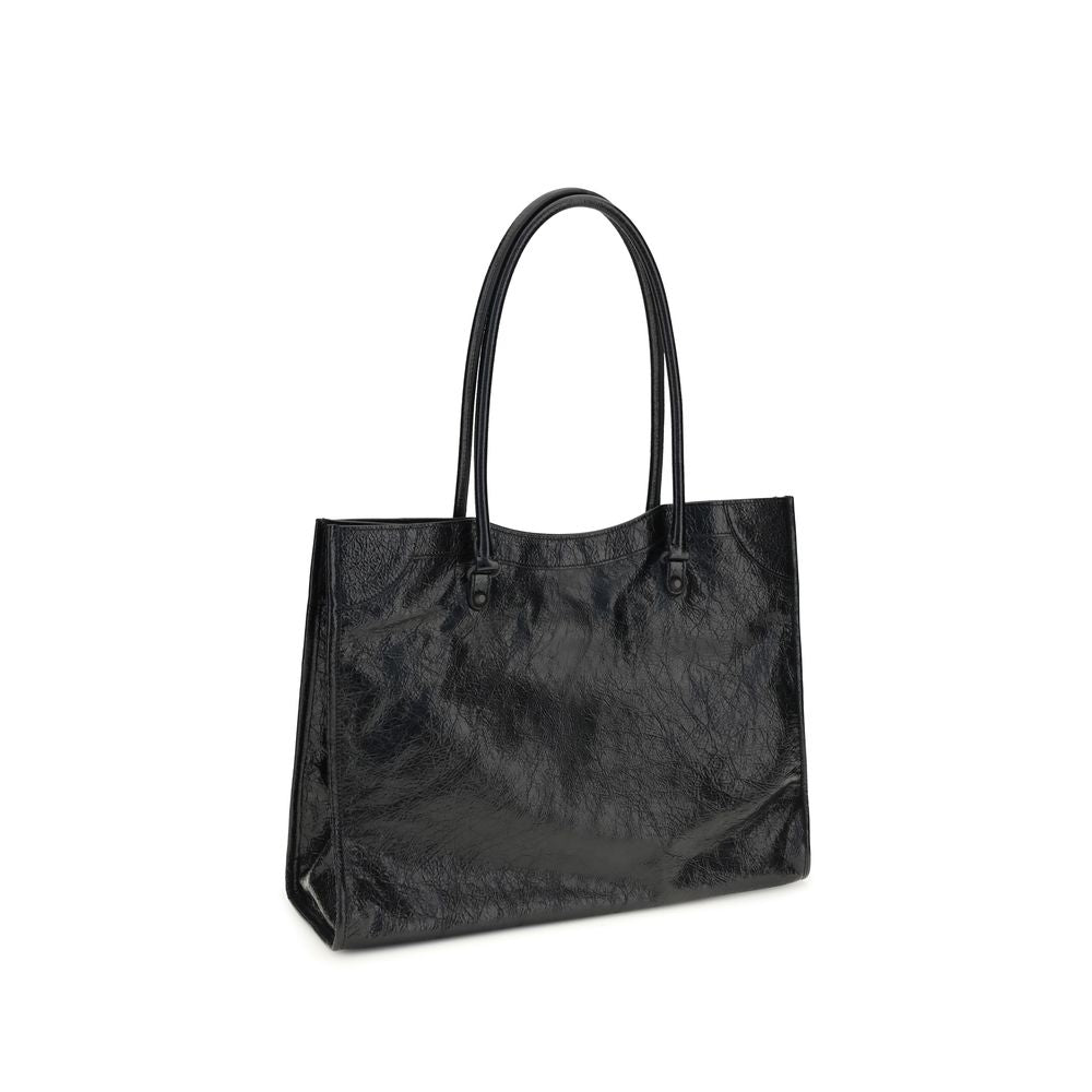 Small Crossbody Tote Shoulder Bag by Balenciaga for women in black features an effortlessly chic silhouette with a secure zipper & magnetic, ample internal-pockets, and versatile crossbody-strap, handle & adjustable-strap for effortlessly chic everyday luxury.