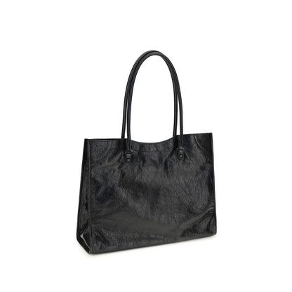 Small Crossbody Tote Shoulder Bag by Balenciaga for women in black features an effortlessly chic silhouette with a secure zipper & magnetic, ample internal-pockets, and versatile crossbody-strap, handle & adjustable-strap for effortlessly chic everyday luxury.