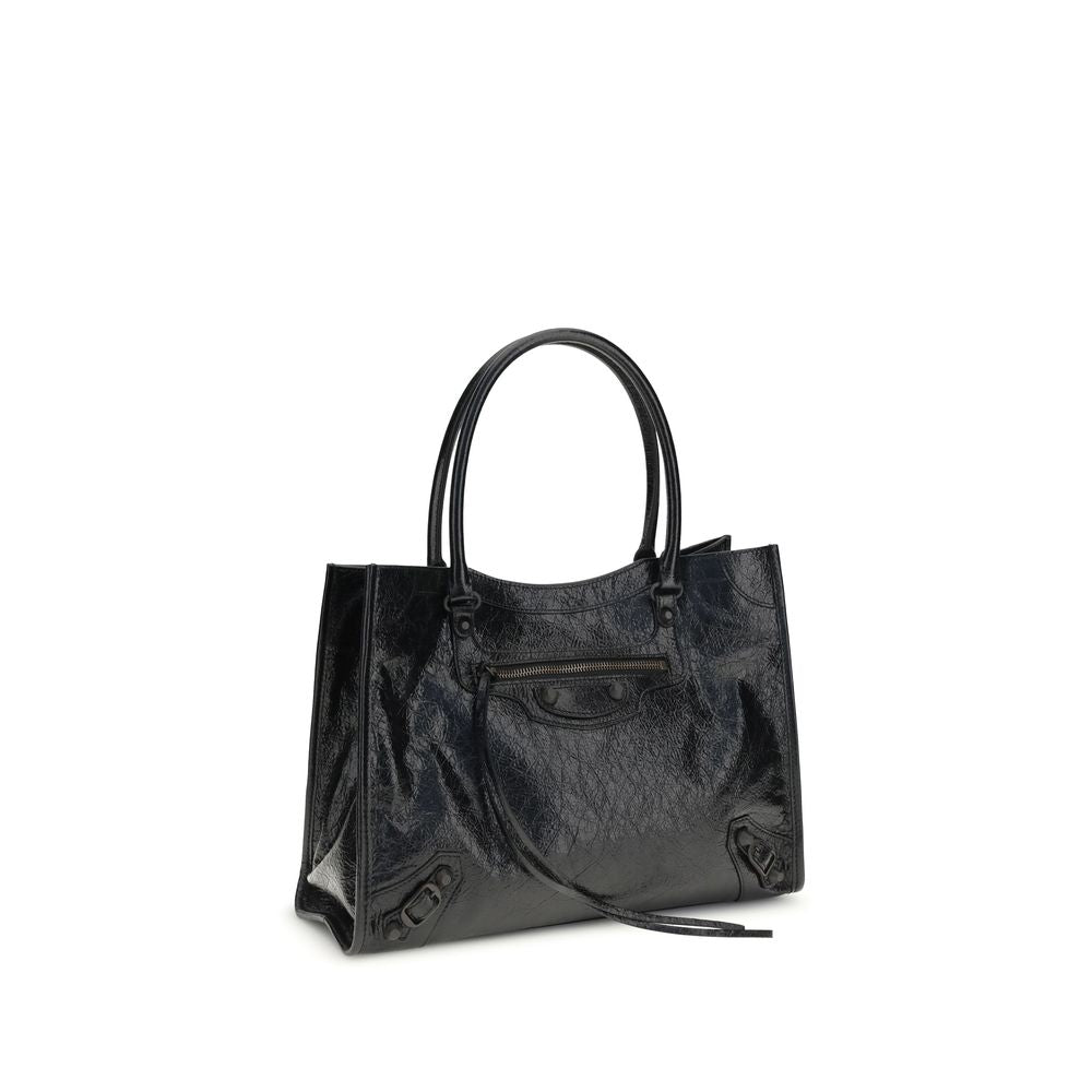 Small 2-in-1 Shoulder & Crossbody Tote Bag by Balenciaga for women in leather black features a enviable silhouette, showcasing a secure zipper & magnetic, ample internal-pockets, and enviable crossbody-strap, shoulder-strap, adjustable-strap & handle for a enviable finish.
