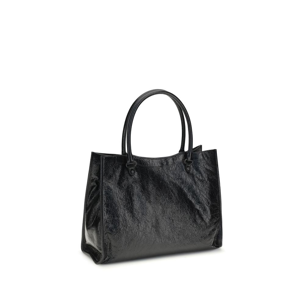 Small 2-in-1 Shoulder & Crossbody Tote Bag by Balenciaga for women in leather black features a effortless chic silhouette with a secure zipper & magnetic, ample internal-pockets, and versatile crossbody-strap, shoulder-strap, adjustable-strap & handle for a effortless chic finish.