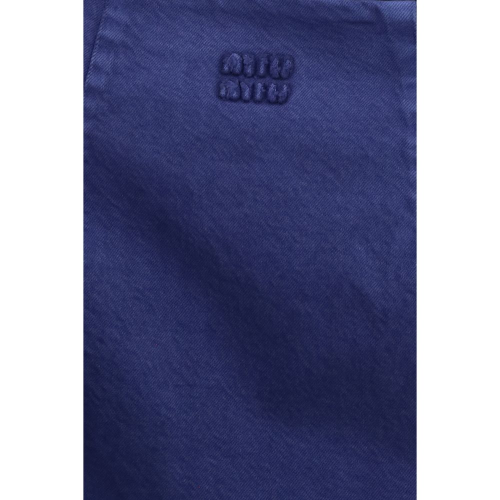 Dress by Miu Miu for women in cotton blue features an cute silhouette, detailed with a and that elegantly flows into a cute short.