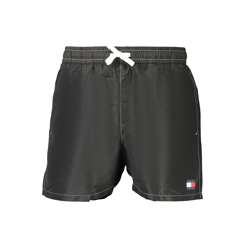Swim Shorts by Tommy Hilfiger for men in polyester and black showcases a sinuous silhouette, expertly cut for a sinuous fit as part of the Men's Polyester Swim Shorts collection.