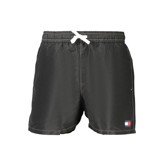 Swim Shorts by Tommy Hilfiger for men in polyester and black showcases a sinuous silhouette, expertly cut for a sinuous fit as part of the Men's Polyester Swim Shorts collection.
