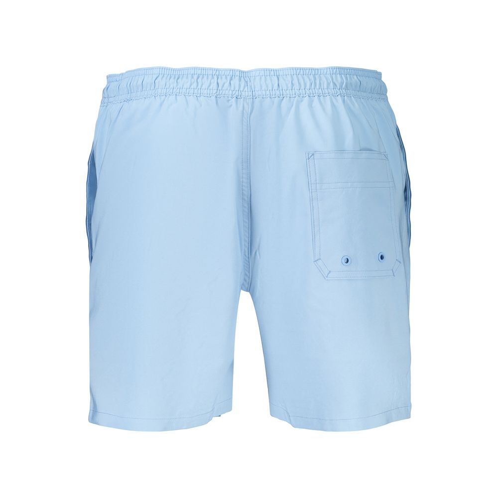 Swim Shorts by Calvin Klein for men in stretch polyester azzurro showcases a sculptural silhouette, expertly capturing the sophisticated essence of the sculptural Waves Men's Stretch Polyester Swim Shorts design for a premium poolside look.