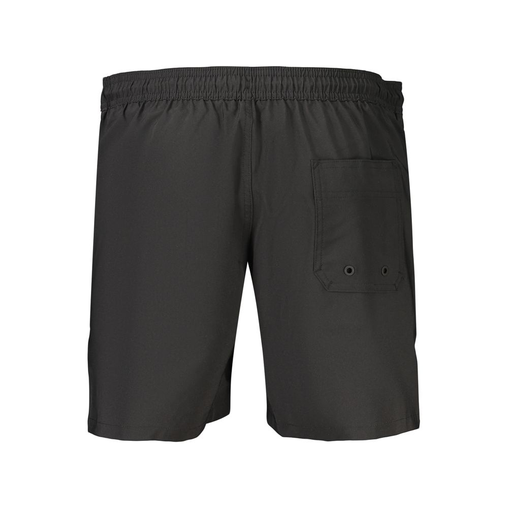 Swim Shorts by Calvin Klein for men in stretch polyester black features an dramatic silhouette that defines the luxurious aesthetic and refined cut of the Men's Stretch Polyester Swim Shorts.