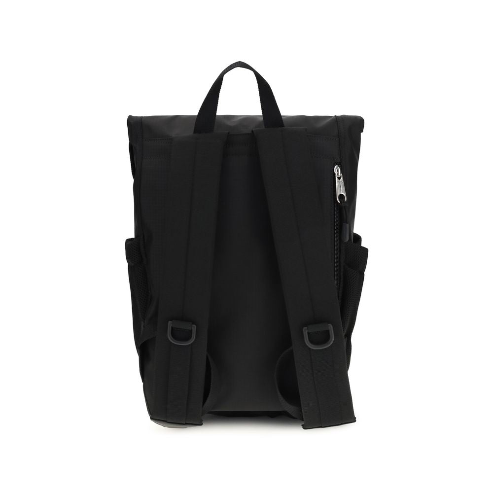 Small Flap Backpack Shoulder Bag by Balenciaga for men in nylon black features a effortless chic silhouette with a secure flap & zipper, ample external-pockets, and versatile shoulder-strap, handle, backpack-strap & adjustable-strap for a effortless chic finish.