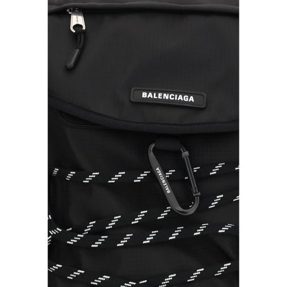 Small Flap Backpack Shoulder Bag by Balenciaga for men in nylon black features a distinguished silhouette, showcasing a secure flap & zipper and distinguished external-pockets with versatile shoulder-strap, handle, backpack-strap & adjustable-strap for a distinguished finish.