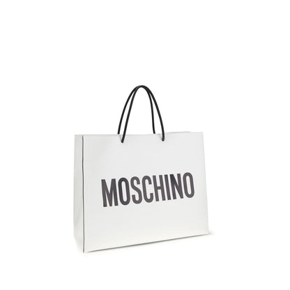 Travel Shoulder Shopper Handbag by Moschino for women in bos taurus calf leather white & print features a signature silhouette, showcasing a secure snap and signature with versatile shoulder-strap & handle for a sophisticated look.
