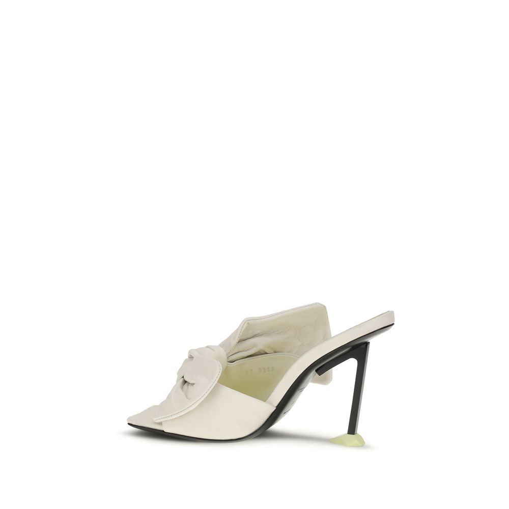 Mules Flat Shoes by Givenchy for women in nappa leather white presents a effortless chic silhouette, showcasing the Women's Nappa Leather Mules Flat Shoes design with a effortless chic and for a sophisticated look.