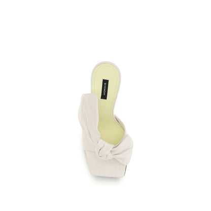 Mules Flat Shoes by Givenchy for women in nappa leather white presents a impeccable silhouette as Women's Nappa Leather Mules Flat Shoes, artfully designed with a and a impeccable for a refined, upscale finish.